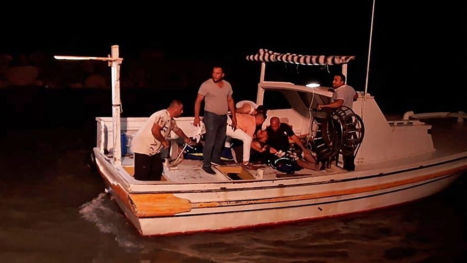 Rescuers search for victims and survivors off the coast of Syria's southern port city of Tartus.