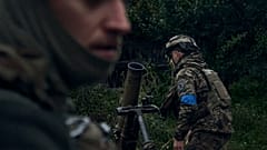 Ukrainian soldiers fire in the recently retaken city of Kupiansk, in the Kharkiv region, Ukraine, Friday, 23 September 2022.