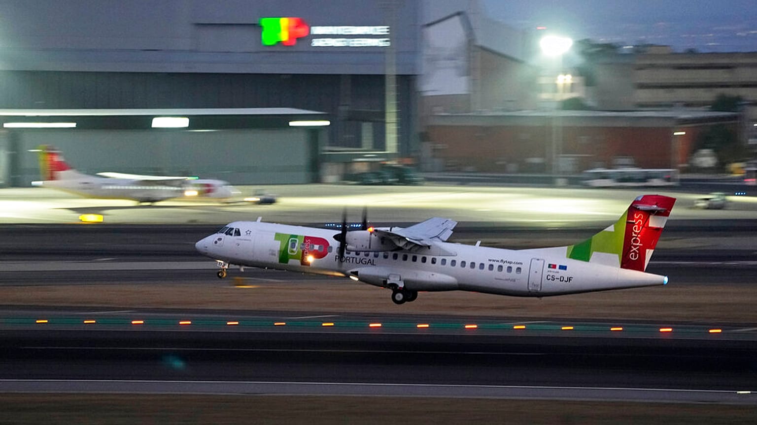 A TAP Air Portugal ATR 72-600 takes off from Lisbon airport.