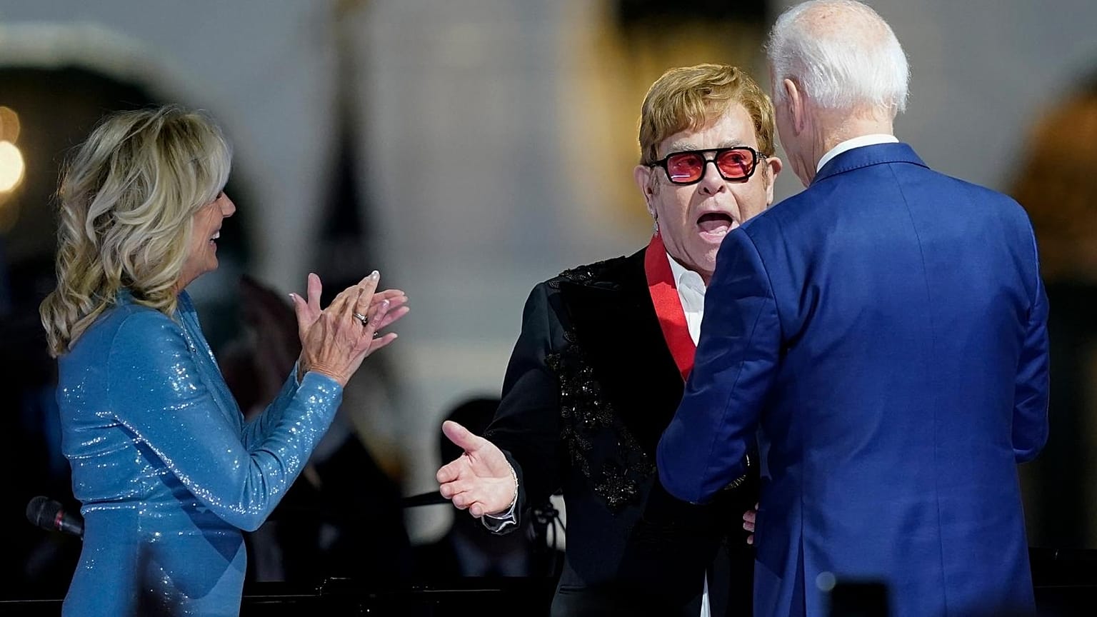 Elton John reacts after President Joe Biden presented him with the National Humanities Medal after a concert on the South Lawn of the White House, 23 Septmber 2022