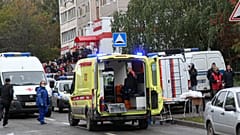 Police and paramedics work at the scene of a shooting at school No. 88 in Izhevsk, Russia, Monday, Sept. 26, 2022.