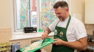 Kenny Tutt cooking at FoodCyle