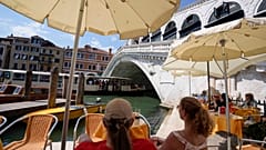 Customers sit at a cafe, in Venice, Italy, Thursday, 17 June 17 2021.