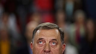 Serb member of the Bosnian Presidency Milorad Dodik listens to the anthem of his SNSD party in Istočno Sarajevo, 27 September 2022