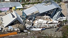 Damaged boats and structures are seen in the aftermath of Hurricane Ian, Thursday, Sept. 29, 2022, in Fort Myers Beach, Fla.