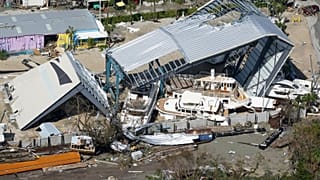 Damaged boats and structures are seen in the aftermath of Hurricane Ian, Thursday, Sept. 29, 2022, in Fort Myers Beach, Fla.
