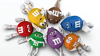 The M&Ms team with their new character, Purple
