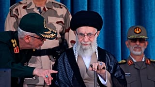 Supreme Leader Ayatollah Ali Khamenei, center, listens to chief of the General Staff of the Armed Forces Gen. Mohammad Hossein Bagheri 