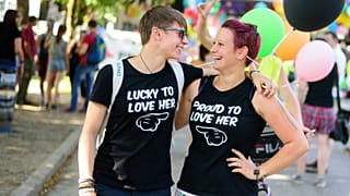 Two women smile at each other as they take part in the Gay Pride Parade in Ljubljana, Slovenia, on June 13, 2015