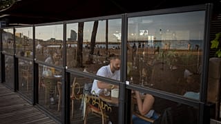 Customers have their dinner in a Spanish restaurant