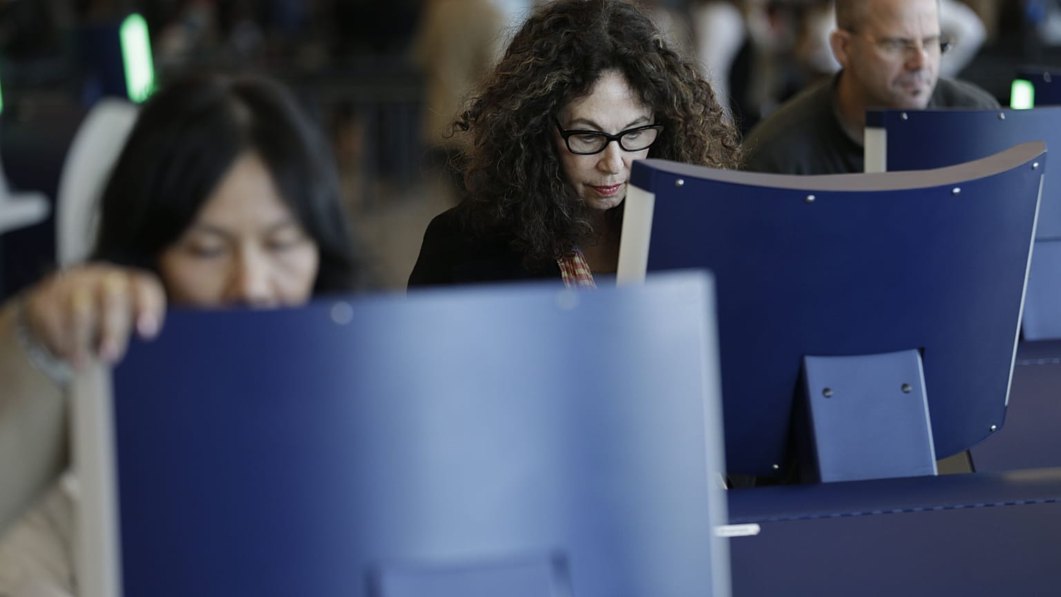 Travellers going through passport control at John F. Kennedy Airport