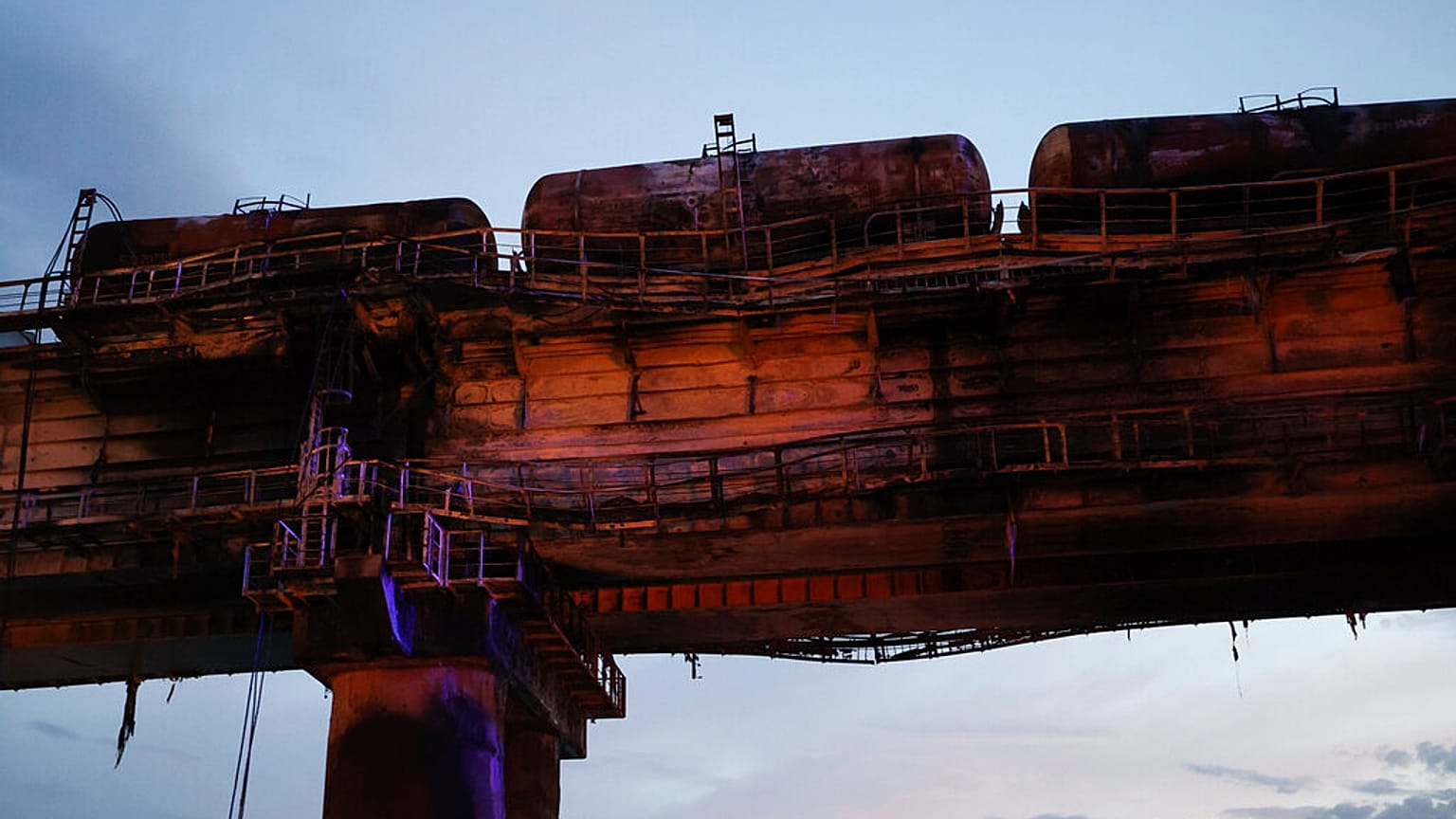 A view of burnt tanks on a damaged part of the Crimean Bridge over the Kerch Strait, near Kerch, Crimea, Saturday, Oct. 8, 2022.