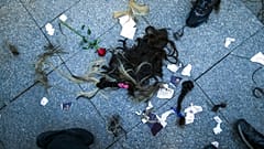 Strands of hair lie on the ground after being cut by several women during a protest against the death of Iranian Mahsa Amini, in Istanbul, Turkey, Sunday, Oct. 2, 2022. 