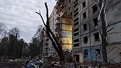 Rescuers work at the scene of a building damaged by shelling in Zaporizhzhia, Ukraine, Sunday, Oct. 9, 2022. 
