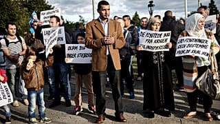 a large group of immigrants living in Denmark welcome migrants at Rodby September 8, 2015