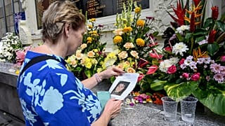 A woman visits a memorial site for the victims to mark the 20th anniversary of the Bali bombings.