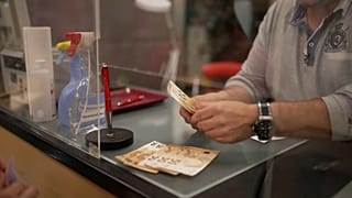 Pawnbroker in Germany lends cash to a customer