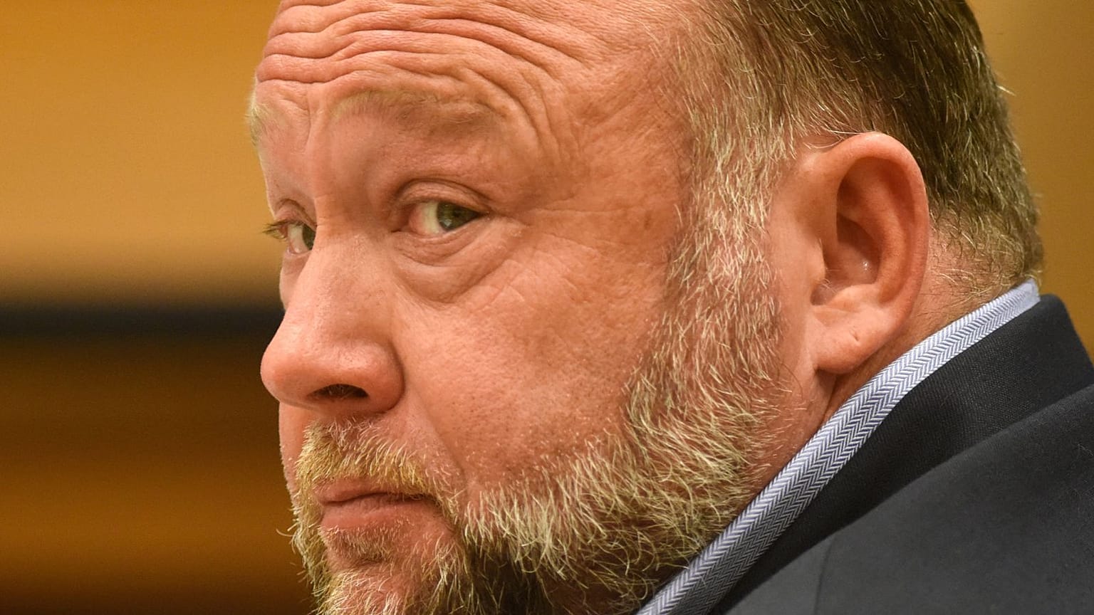 Infowars founder Alex Jones appears in court to testify during the Sandy Hook defamation damages trial at Connecticut Superior Court in Waterbury, Conn., 22 Sept 2022