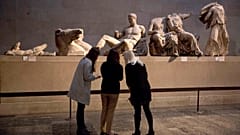 A statue thought to represent Greek god Dionysos, from the east pediment of the Parthenon, at an exhibition on ancient Greek art, at the British Museum, London, Jan. 8, 2015.