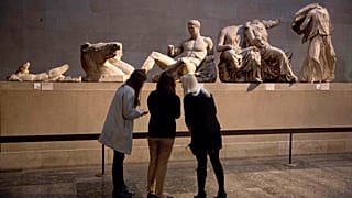 A statue thought to represent Greek god Dionysos, from the east pediment of the Parthenon, at an exhibition on ancient Greek art, at the British Museum, London, Jan. 8, 2015.