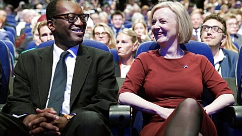 Britain's Chancellor of the Exchequer Kwasi Kwarteng, left and Prime Minister Liz Truss react, during a tribute to the late Queen Elizabeth II at the start of the Conservative