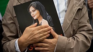 A portrait of Mahsa Amini is held during a rally in Washington calling for regime change in Iran. 