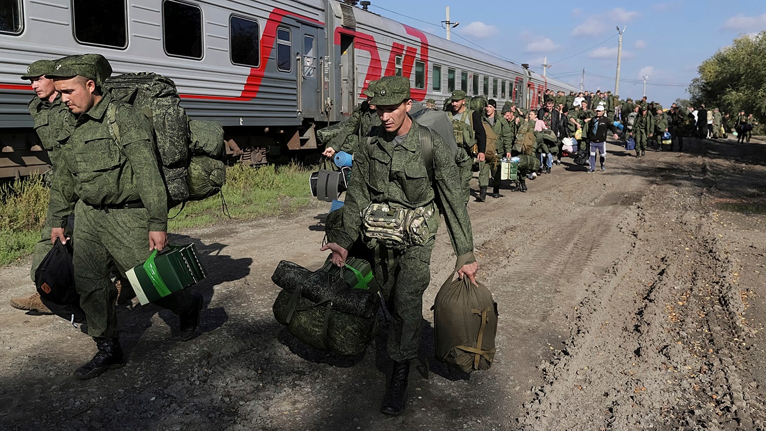 Russian recruits walk to take a train at a railway station in Prudboi, Volgograd region of Russia, 29 September 2022