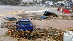 Cars submerged in water, following heavy thunderstorms, in the village of Agia Pelagia, on the island of Crete, 15 October 2022