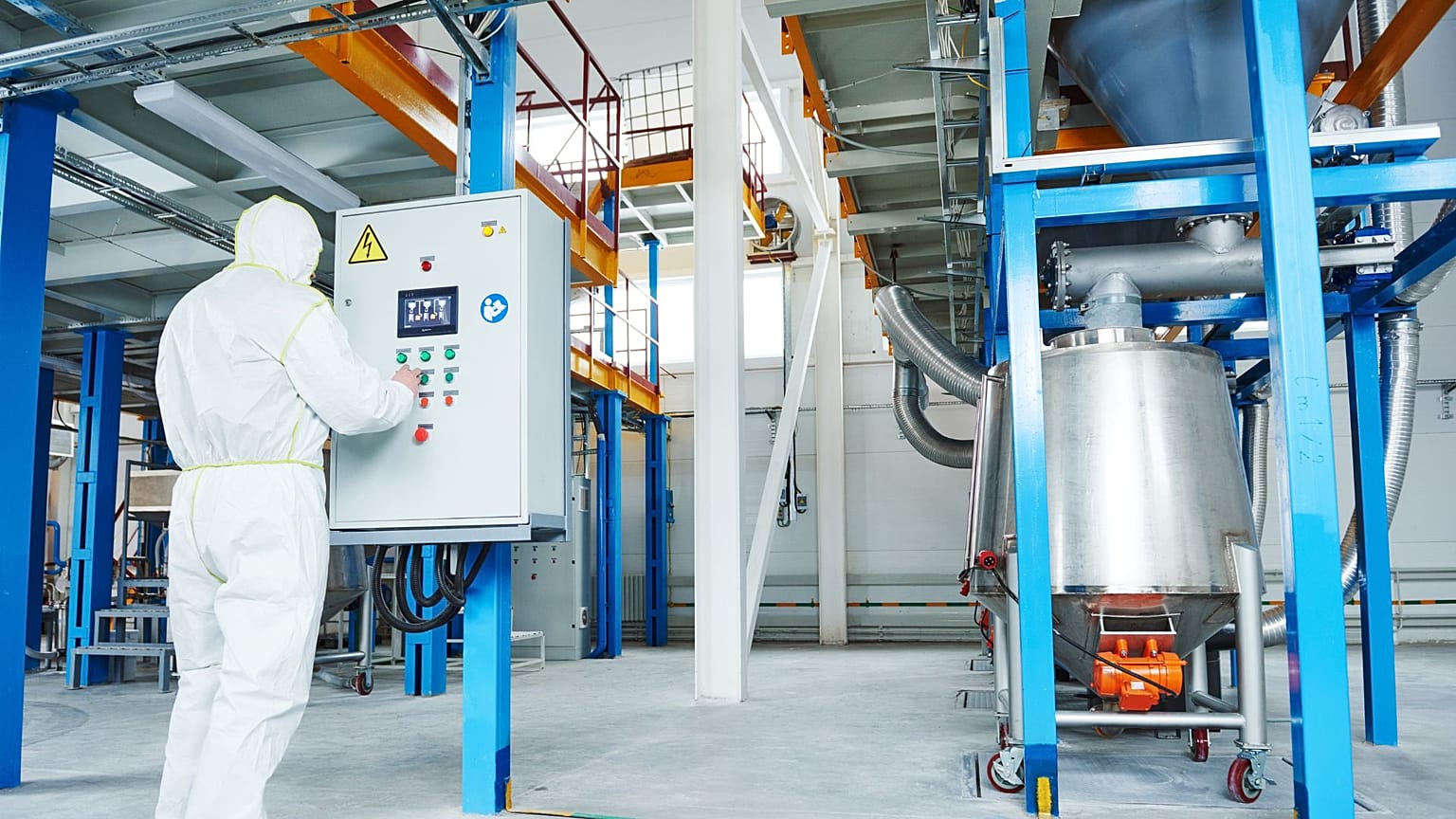A worker in an industrial chemical factory. The European commission may delay planned reform of its chemical regulation laws. 