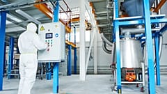 A worker in an industrial chemical factory. The European commission may delay planned reform of its chemical regulation laws. 