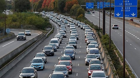 Commuters stuck in a rush-hour traffic jam on the outskirts of Paris