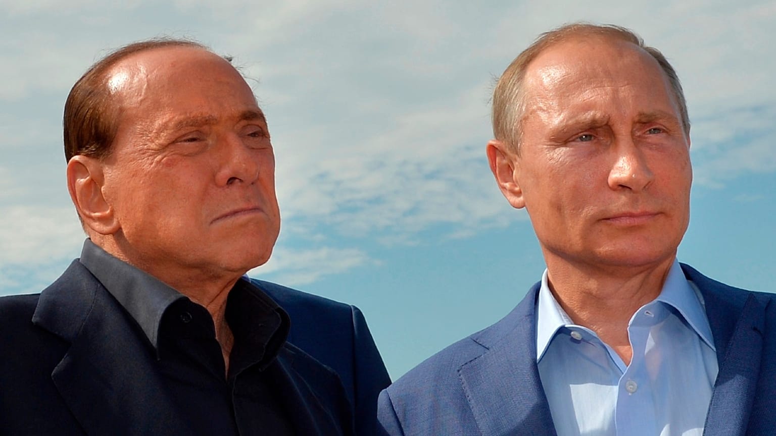 Russian President Vladimir Putin, right, and former Italian Prime Minister Silvio Berlusconi visit a memorial to the soldiers from Sardinia killed in the Crimean War, near Mou