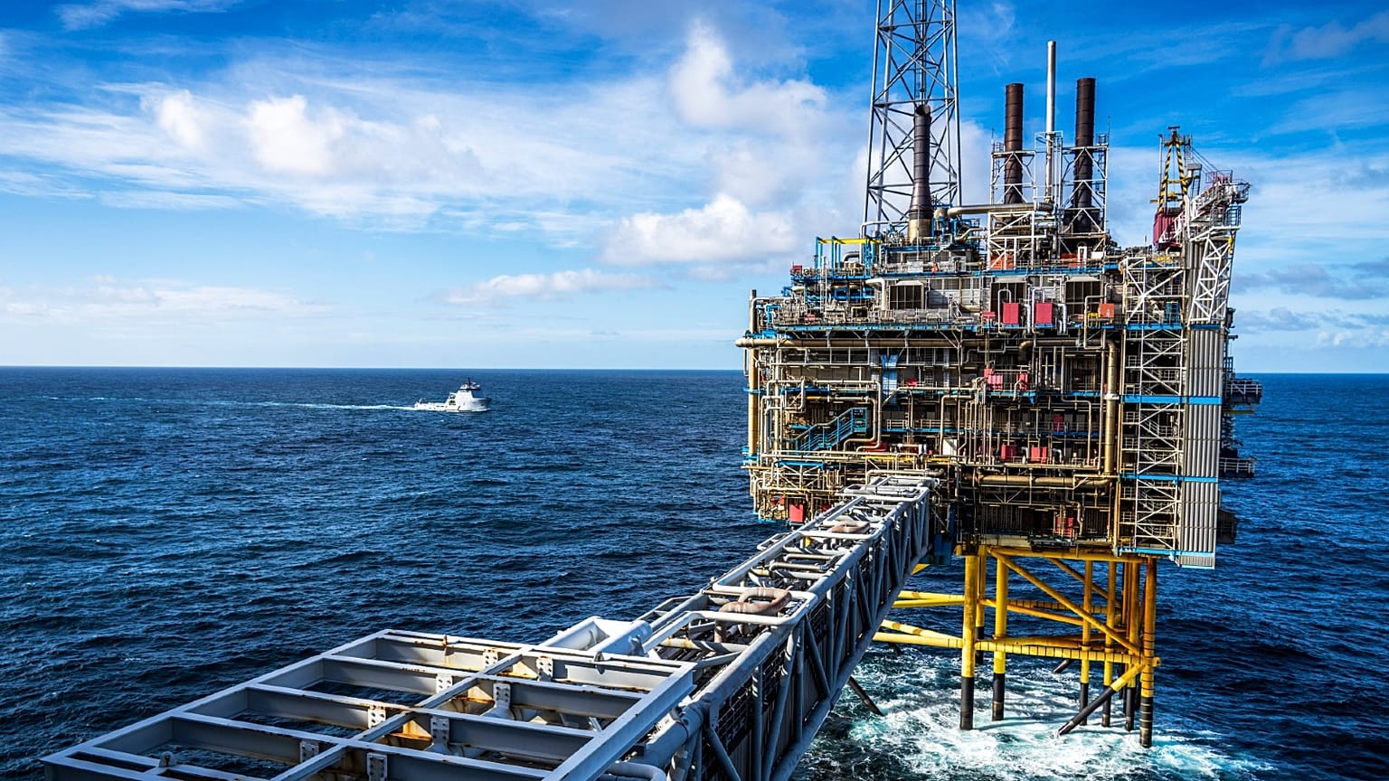 A view of the Sleipner A gas platform, Norway, Saturday, Oct. 1, 2022 as a Coast Guard ship patrols around the platform.