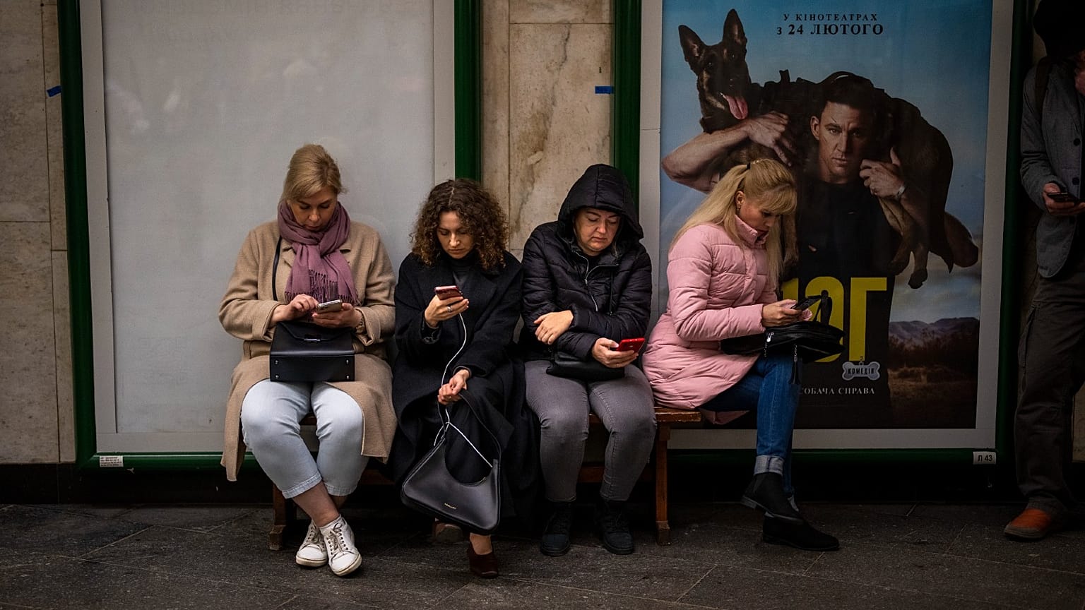 People sit in the Kyiv subway, using it as a bomb shelter, in Kyiv, Ukraine, on Wednesday, Oct. 19, 2022.