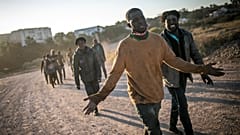 Migrants arrive on Spanish soil after crossing the fences separating the Spanish enclave of Melilla from Morocco, in Melilla, Spain.