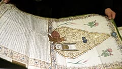 A Pantokrator monk holds a manuscript at the library of Pantokrator Monastery in the Mount Athos, northern Greece.