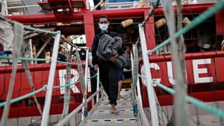 Migrants disembark in the port of Taranto, southern Italy.