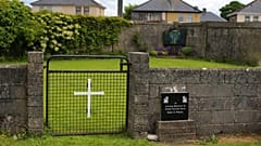 This June 4, 2014 file photo shows the site of a mass grave for children who died in the Tuam mother and baby home, in Tuam, County Galway, Ireland