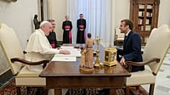 French President Emmanuel Macron, right, talks with Pope Francis during a private audience at the Vatican, Friday, 26 November 2021.