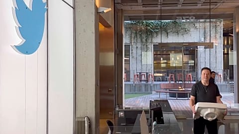 This image from the Twitter page of Elon Musk shows Musk entering Twitter headquarters carrying a sink through the lobby area on Wednesday, Oct. 26, 2022 in San Francisco.