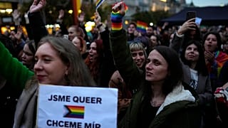 Protesters in Prague held signs reading "We are queer, we want peace."