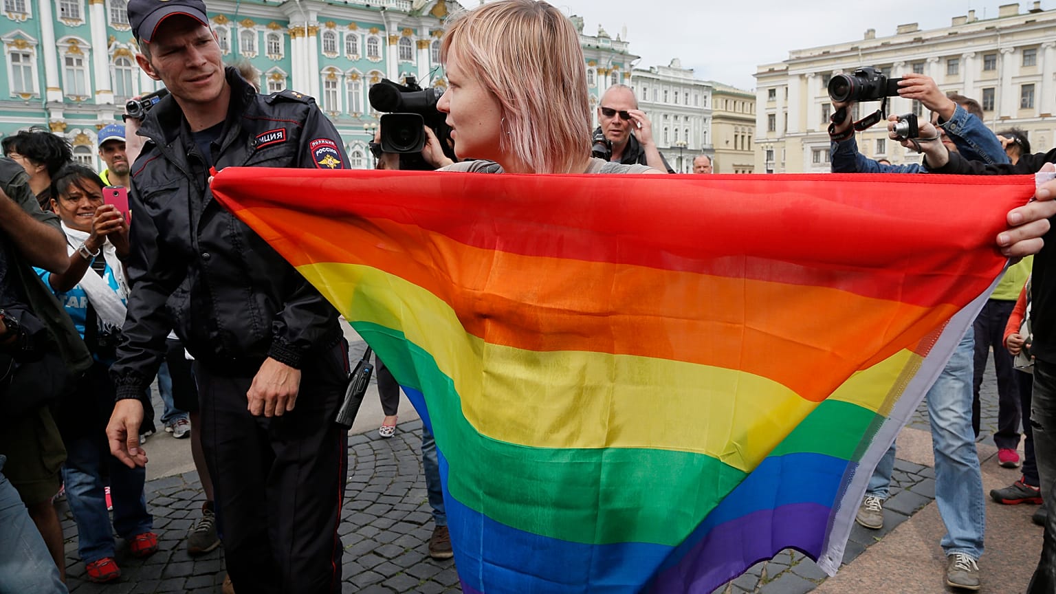 A gay rights activist stands with a rainbow flag during a protest in St. Petersburg in 2015.