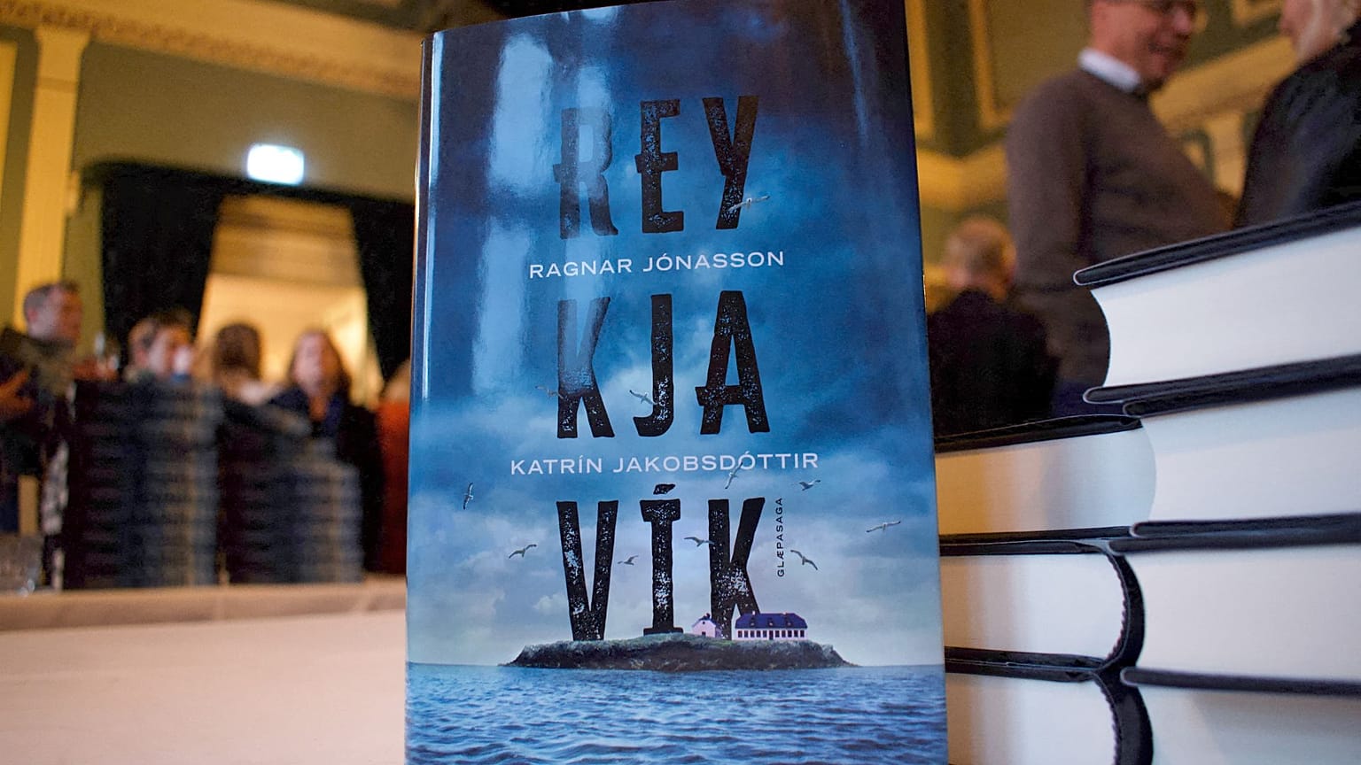 Iceland’s Prime Minister Katrin Jakobsdottir (L) and Icelandic author Ragnar Jonasson