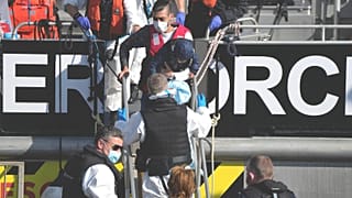 FILE: Migrants disembark from a British Border Force boat after being picked up from a dingy in the English Channel, 16 Sept 2021