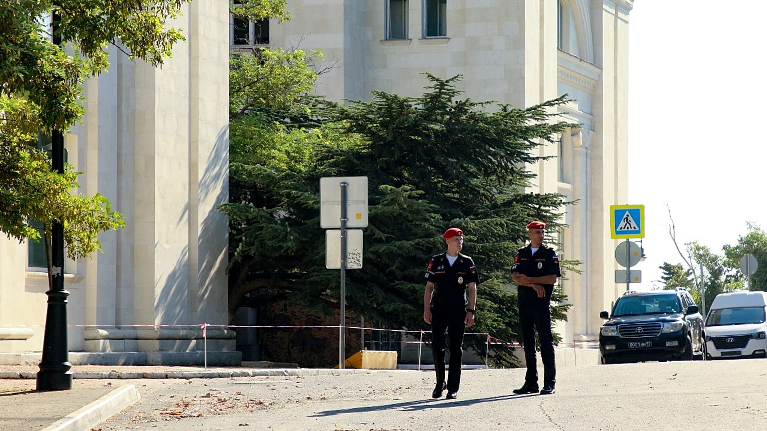 Russian soldiers guard the headquarters of Russia's Black Sea Fleet in Sevastopol, Crimea, Sunday, July 31, 2022, following an explosion that injured six people.