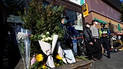 Flowers are seen near the scene of a deadly accident in Seoul, South Korea, Sunday, Oct. 30, 2022, following Saturday night's Halloween festivities. 