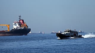 A boat with Russian, Ukrainian, Turkish and UN officials heads to inspect cargo ships coming from Ukraine loaded with grain, in the Marmara Sea, Istanbul, Turkey, Oct. 1, 2022