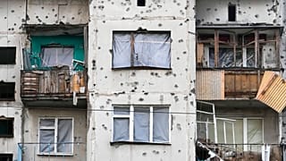 Traces of shrapnel from the Russian rockets cover a multi storey house in central Slavyansk, Donetsk region, Ukraine, Saturday, Oct. 29, 2022.