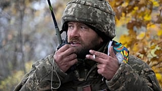 A Ukrainian officer gives commands during the battle in the front line near Bakhmut, 27 October 2022