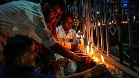 People lit candles for the victims of the tragedy
